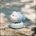 Ceramic Rotating Fish Figurine – Cute Pastel Blue Spinning Goldfish Desk Toy on Light Blue Base