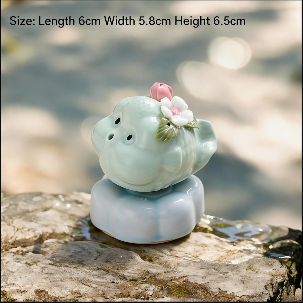 Ceramic Rotating Pig Figurine – Cute Mint Green Piggy with Pink & White Floral Crown on Light Blue Lotus Base