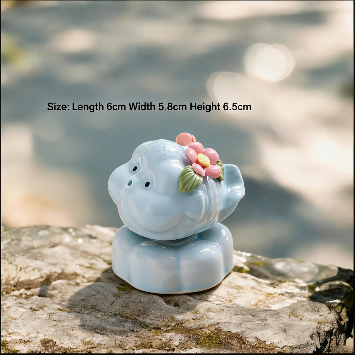 Ceramic Rotating Pig Figurine – Cute Chubby Blue Piggy with Pink Floral Crown on Light Blue Lotus Base
