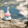 Ceramic Rotating Garlic Duck Figurine – Cute Pink Gradient Goose Desk Toy on Light Blue Base