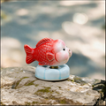 Ceramic Rotating Fish Figurine – Cute Red Spinning Goldfish Desk Toy on Light Blue Base