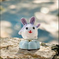 Ceramic Rotating Rabbit Figurine – Cute Purple Bunny with Red Nose on Light Blue Lotus Base