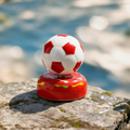 Ceramic Rotating Soccer Ball Figurine – Red & White Spinning Football Desk Toy & Sports Decor