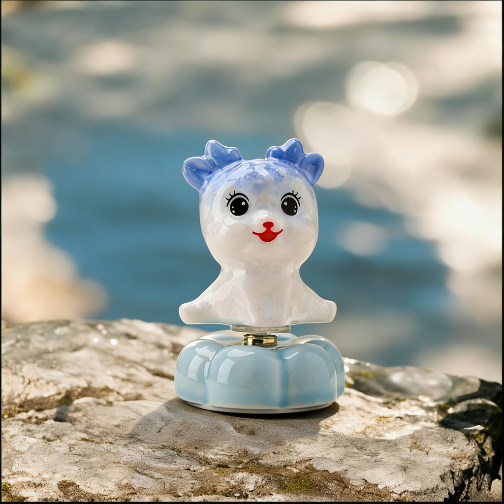 Ceramic Rotating Deer Figurine – Cute Blue Fawn with Eyelashes & Red Nose on Light Blue Lotus Base
