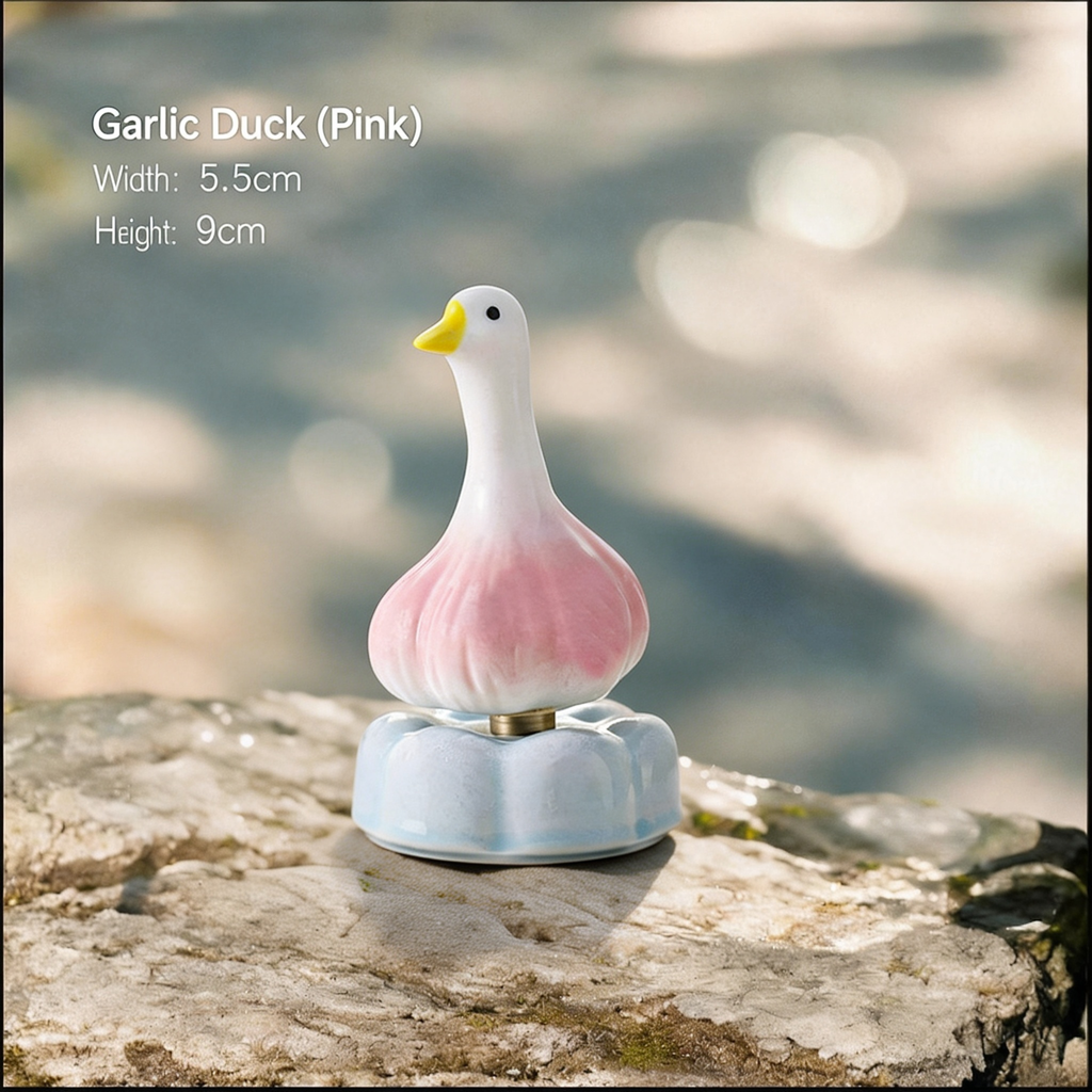 Ceramic Rotating Garlic Duck Figurine – Cute Pink Gradient Goose Desk Toy on Light Blue Base