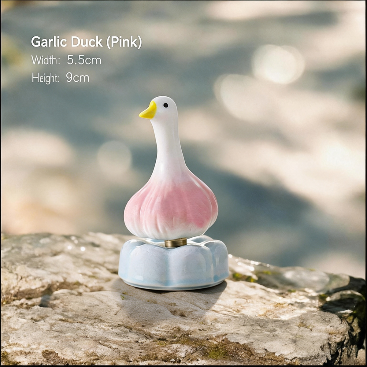 Ceramic Rotating Garlic Duck Figurine – Cute Pink Gradient Goose Desk Toy on Light Blue Base