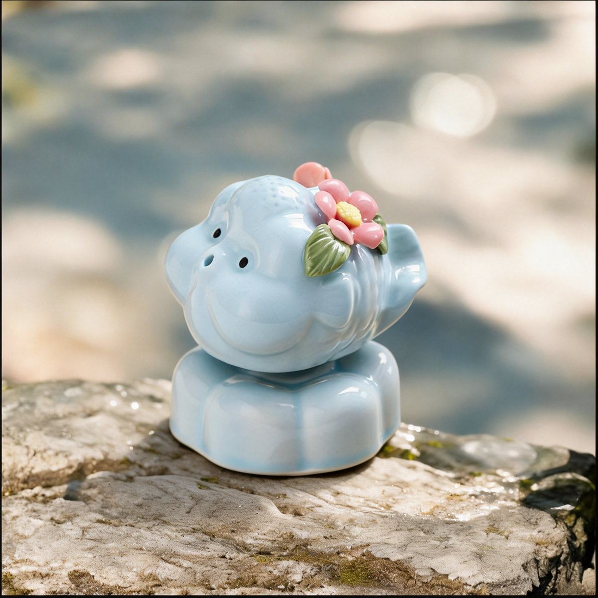 Ceramic Rotating Pig Figurine – Cute Chubby Blue Piggy with Pink Floral Crown on Light Blue Lotus Base