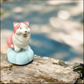 Ceramic Rotating Dog Figurine – Cute Pink & White Smiling Puppy Desk Toy on Light Blue Base