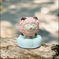 Ceramic Rotating Sheep Figurine – Cute Pink Fluffy Lamb Desk Toy on Light Blue Cloud Base