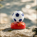 Ceramic Rotating Soccer Ball Figurine – Blue & White Spinning Football Desk Toy on Red Base