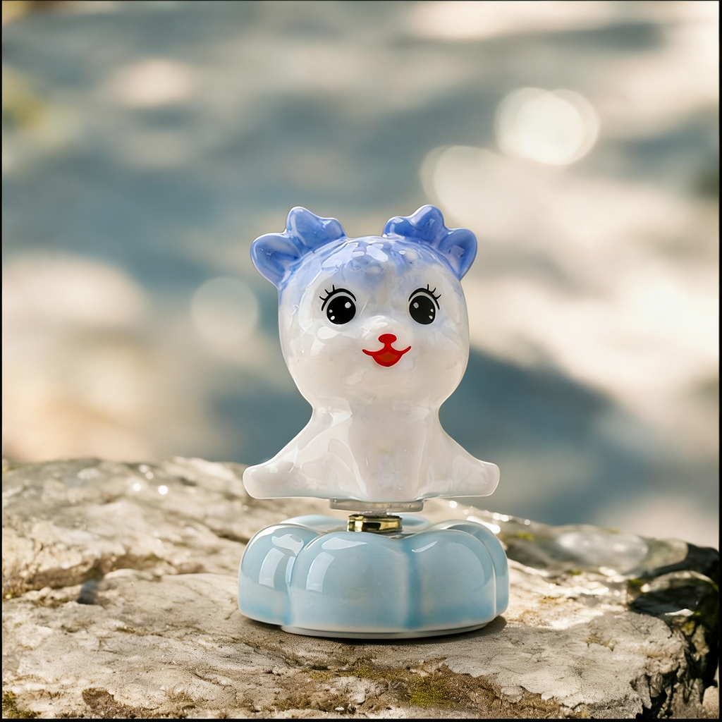 Ceramic Rotating Deer Figurine – Cute Blue Fawn with Eyelashes & Red Nose on Light Blue Lotus Base